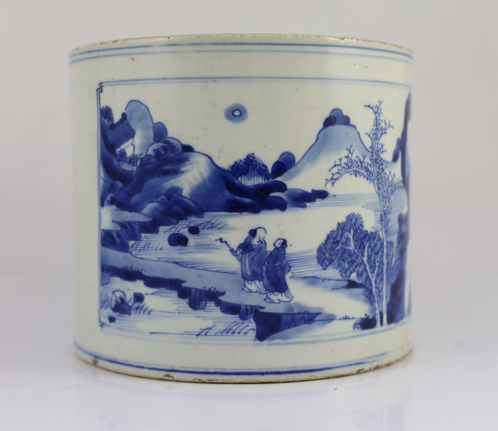 A Chinese blue and white ‘landscape’ brushpot, bitong, Kangxi period, 17.8cm diameter, 15.2cm high, fritting to edges